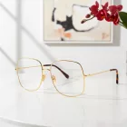 Tom Ford FT6048-B szemüvegkeret csillógó deep arany/clear/kék-világos blokk lencsék női